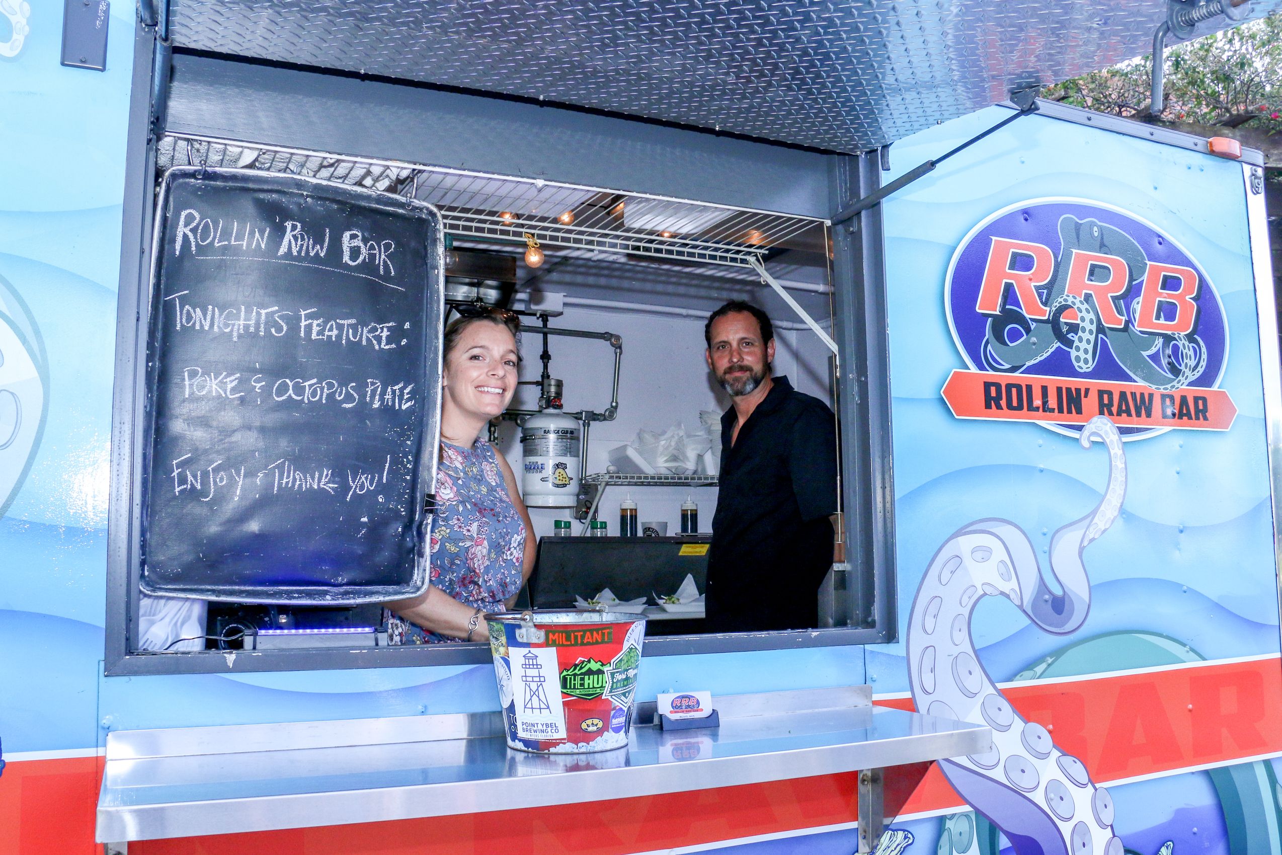 Two employees in a food truck