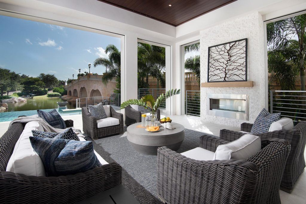 view of the living room and outdoor living space of one of the Isola Bella's luxury single-family services